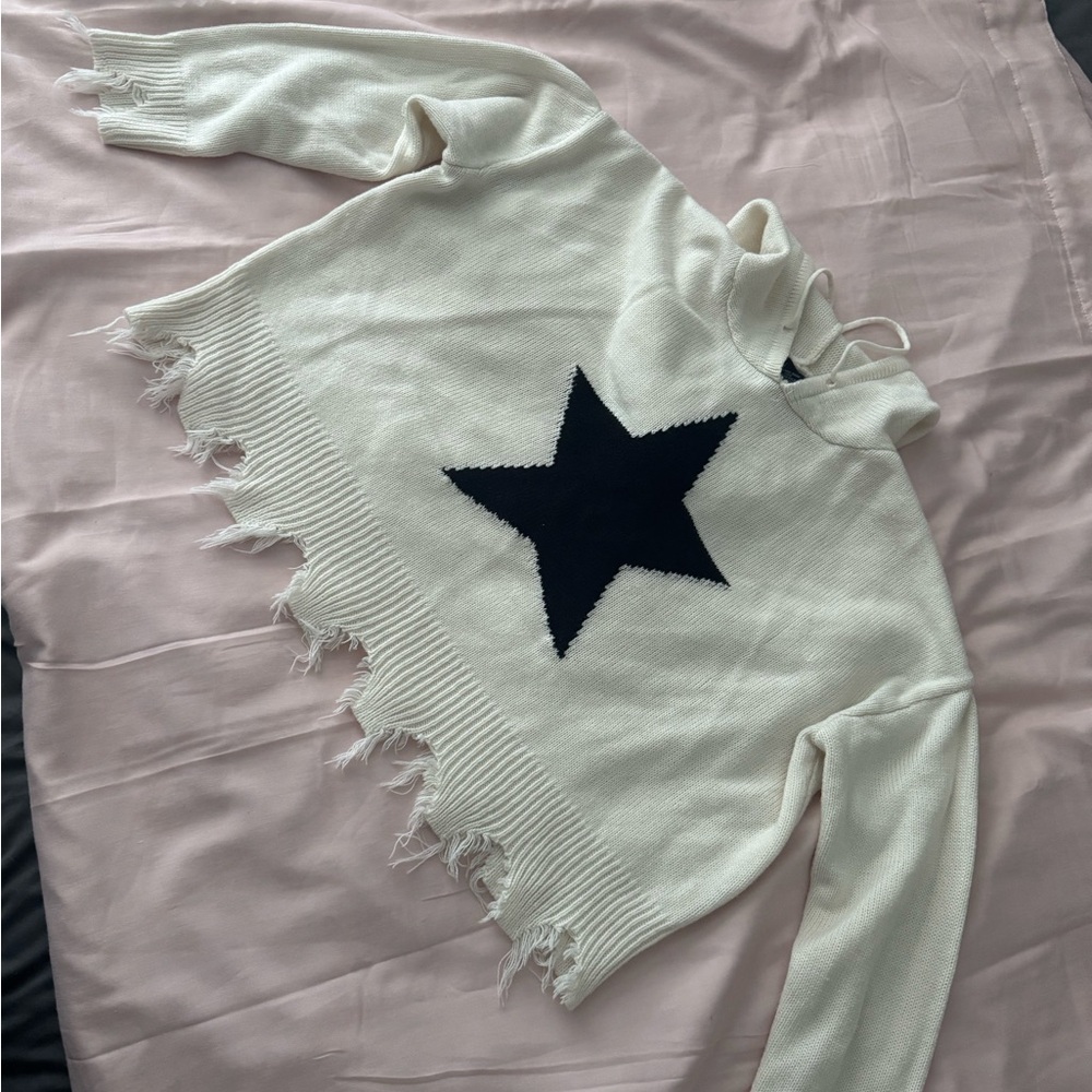Elegant Cream Turtleneck Sweater with Black Star